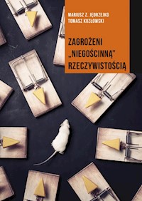 Zagrożeni niegościnną rzeczywistością - Jędrzejko Mariusz Z., Kozłowski Tomasz - książka